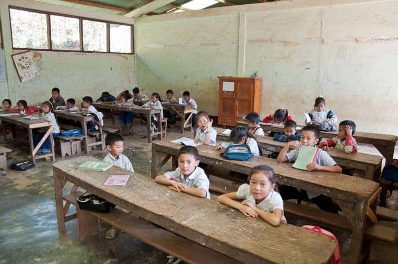 kids at benches in a rural classroom
