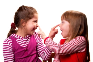 two cute girls touching eachother's nose