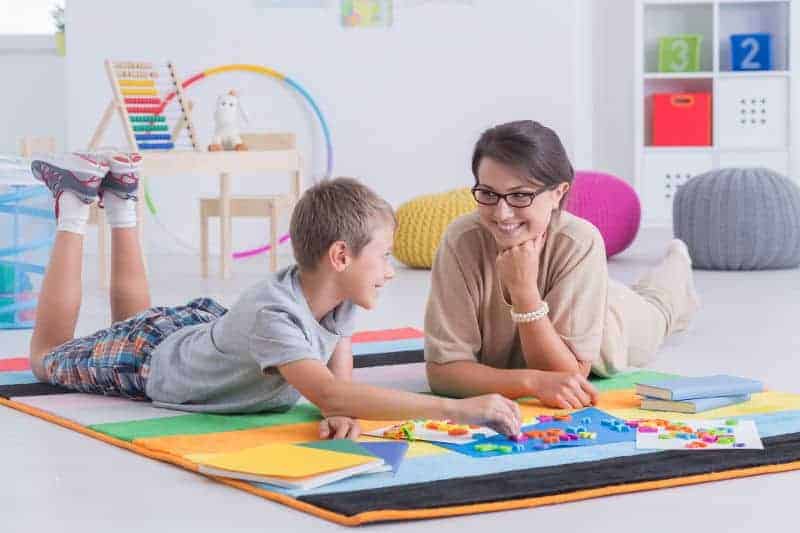 private tutor playing with an 8-year-old child