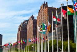 flags flying outside United Nations building