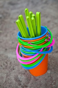 colourful buckets at the beach