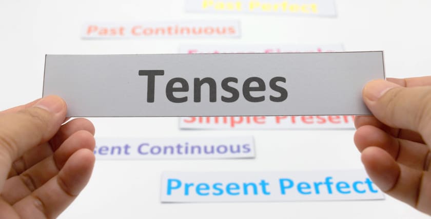 present tenses written on a card