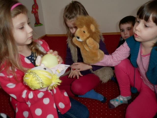 preschool ELLs playing with puppets
