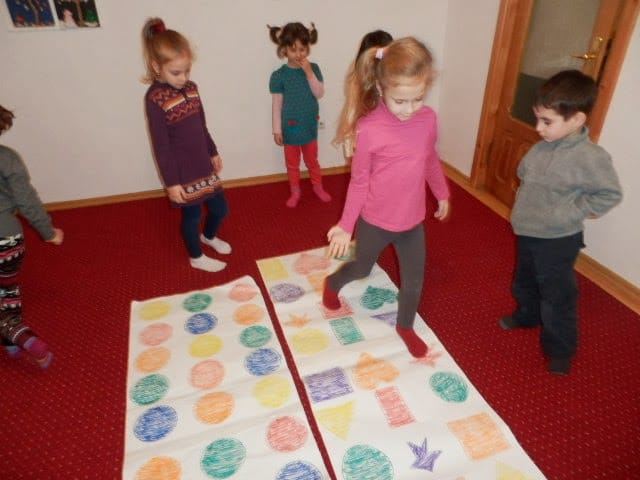 preschool children playing Twister